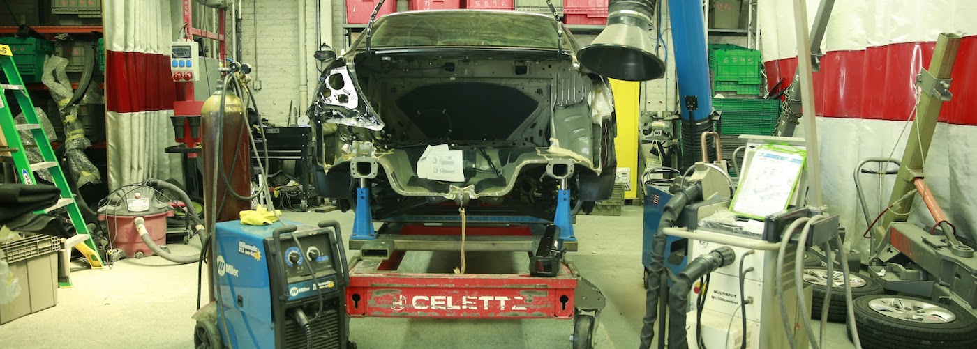 Damaged car being repaired