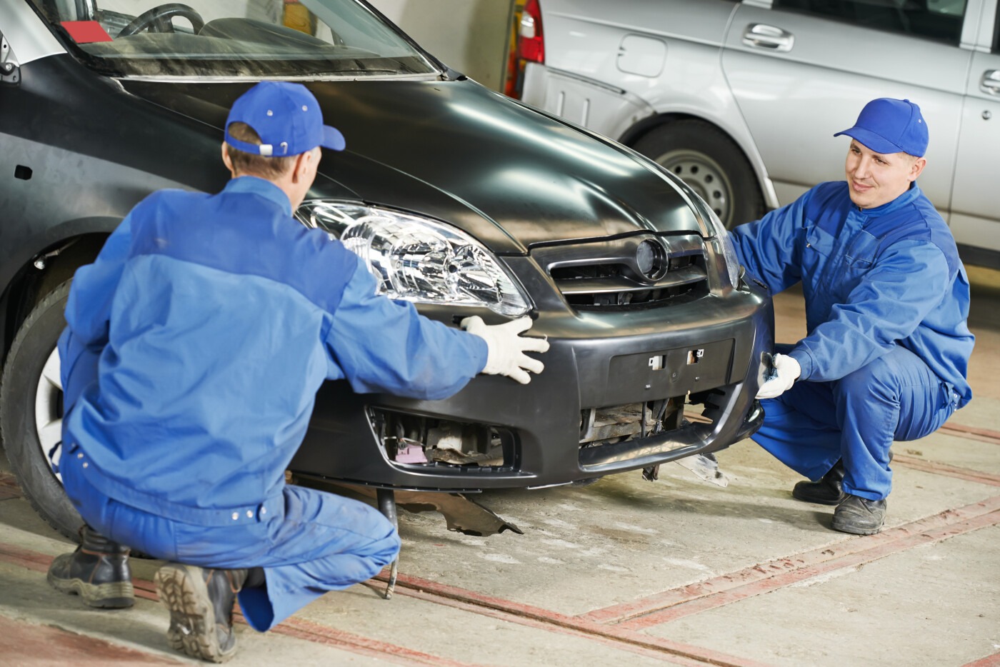 Men Working on a Bumper